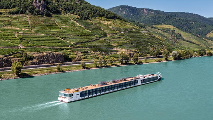 A Saga river cruise ship sailing on a river